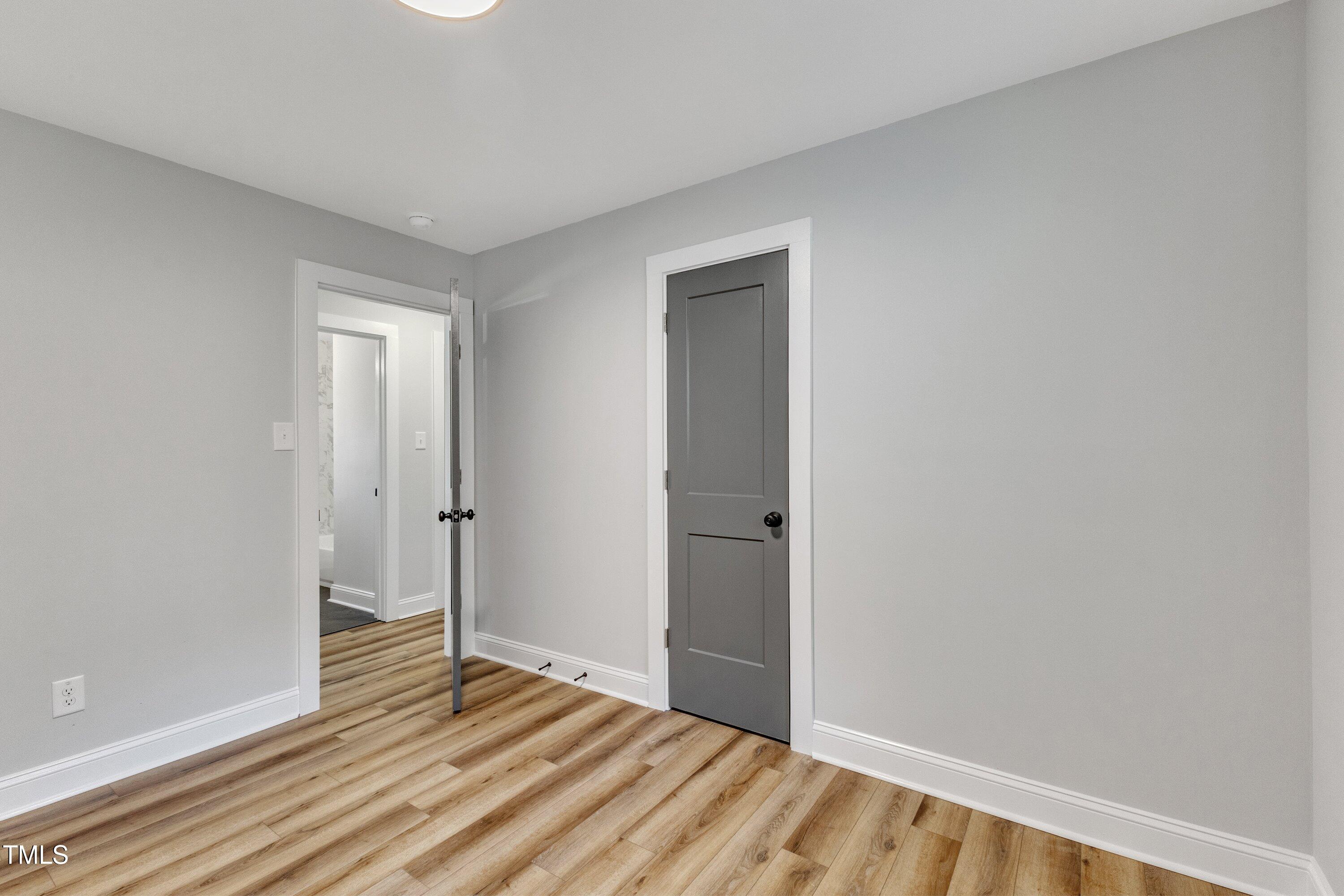 712 Bailey Drive Raleigh, NC 27610 - Photo 23 of 33 a view of an empty room and wooden floor