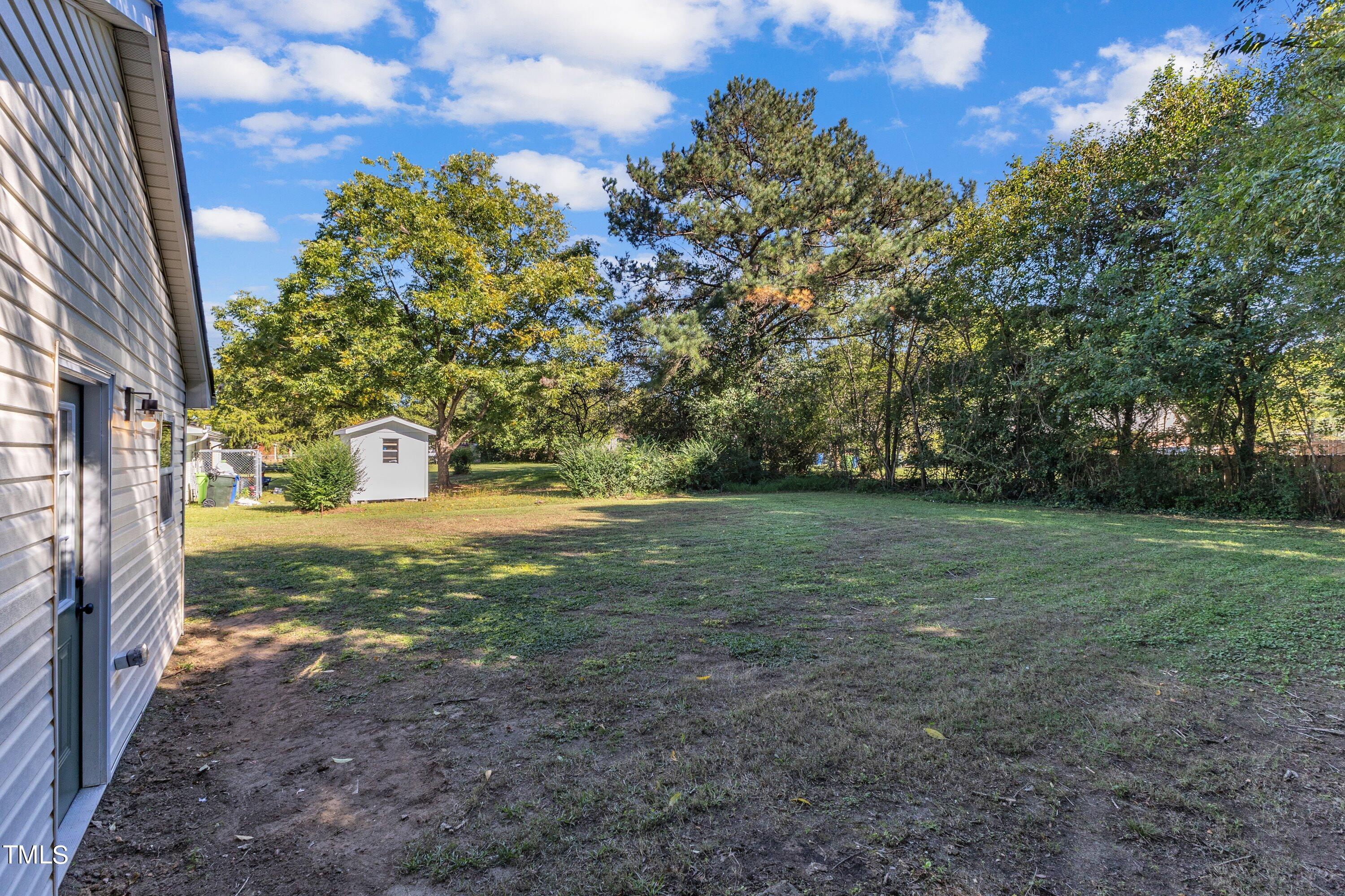 712 Bailey Drive Raleigh, NC 27610 - Photo 26 of 33 a view of a yard with plants and trees