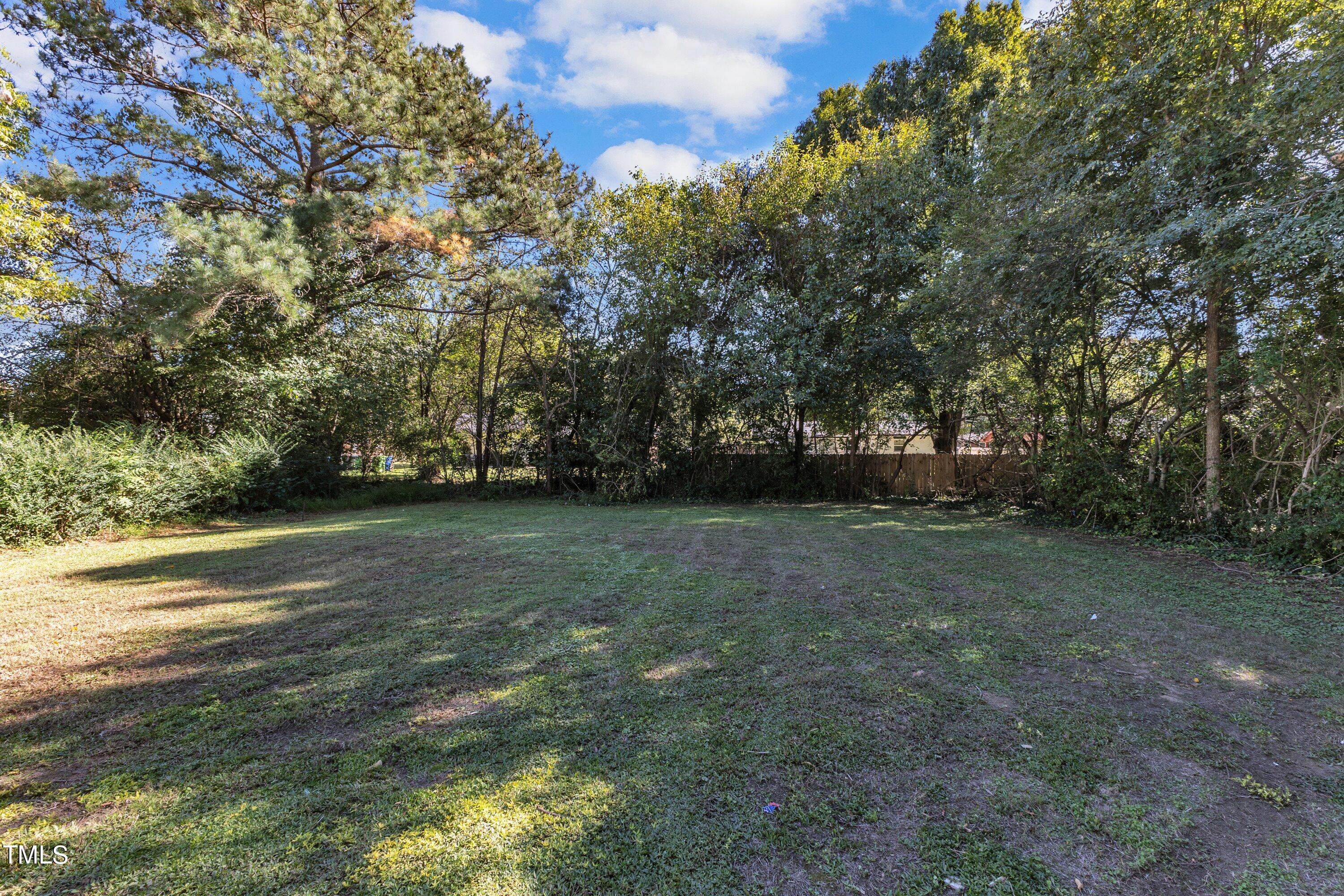 712 Bailey Drive Raleigh, NC 27610 - Photo 28 of 33 a view of outdoor space with deck and yard