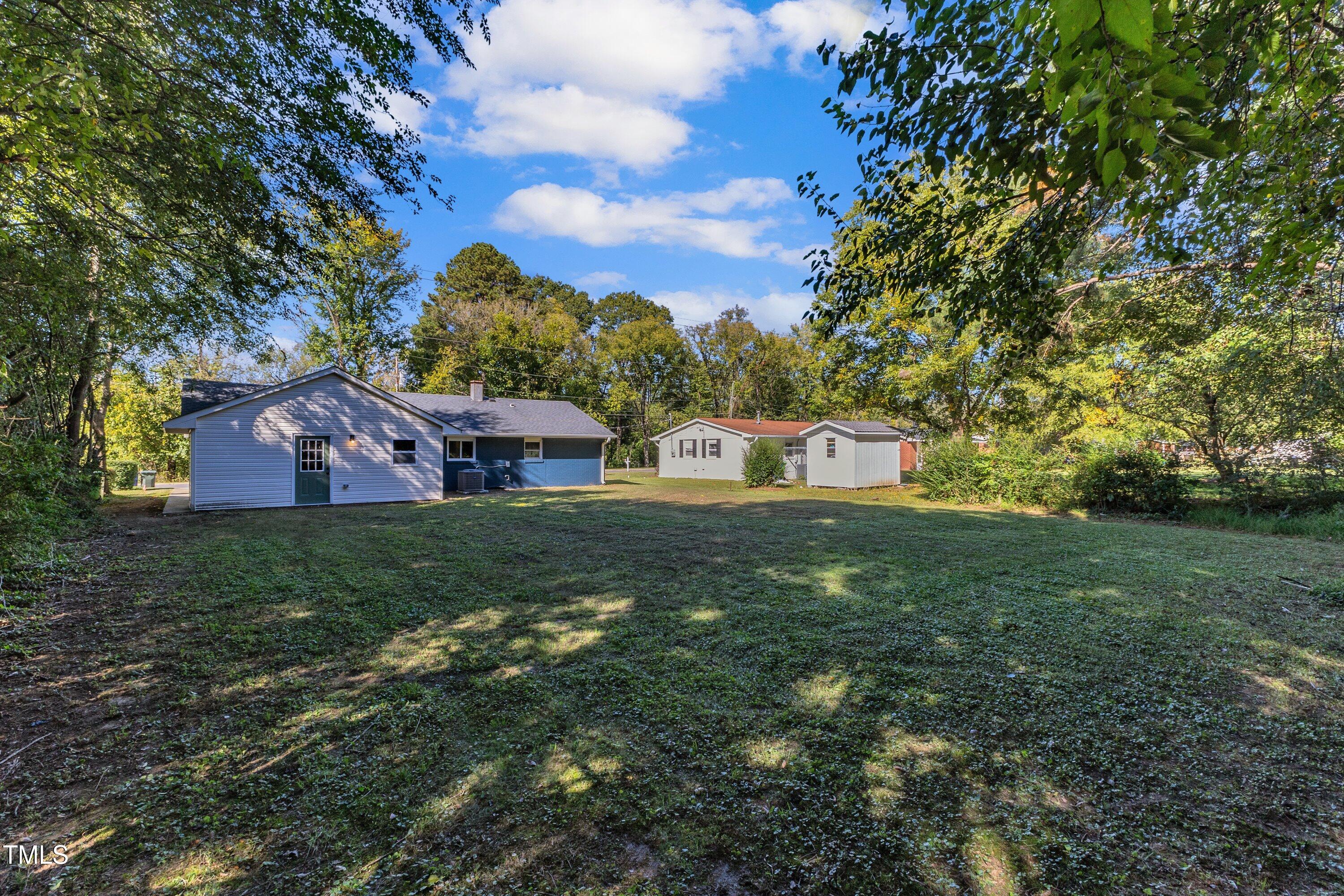 712 Bailey Drive Raleigh, NC 27610 - Photo 33 of 33 a backyard of a house with lots of green space
