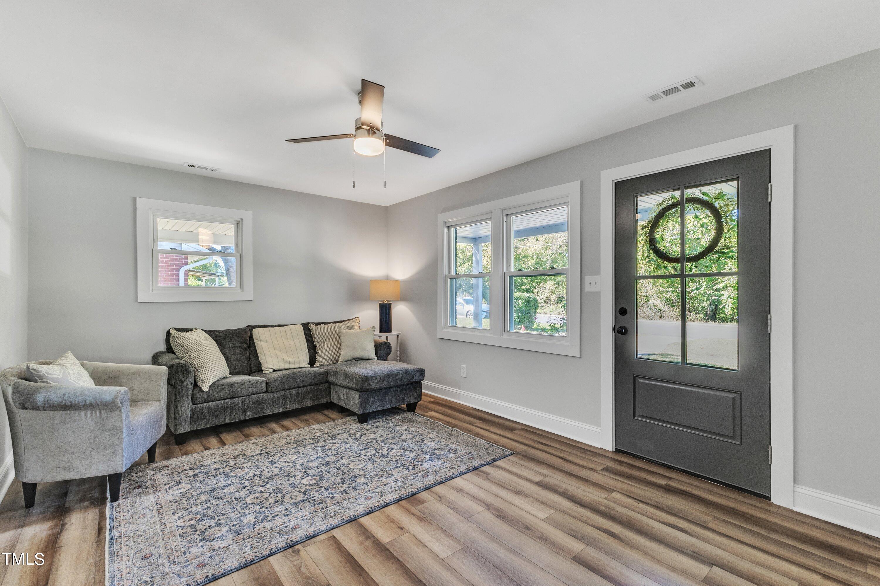 712 Bailey Drive Raleigh, NC 27610 - Photo 7 of 33 a living room with furniture and a window