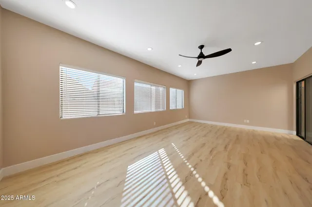 a kitchen with stainless steel appliances granite countertop a sink and a stove