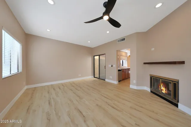 a kitchen with stainless steel appliances granite countertop a stove and a refrigerator