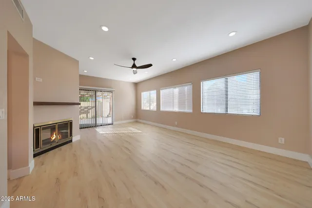 a large kitchen with stainless steel appliances granite countertop a lot of counter space and a sink
