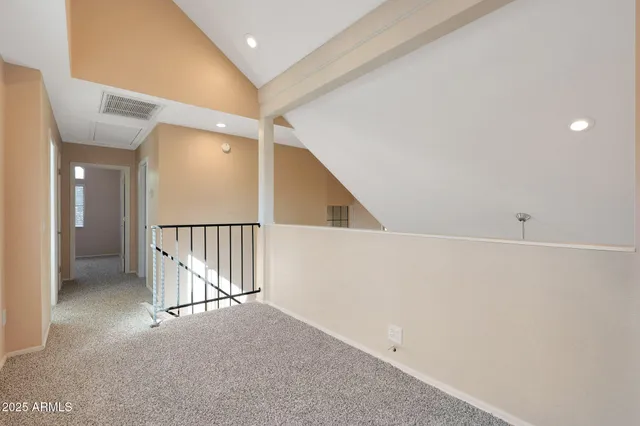 a bathroom with a granite countertop toilet sink and mirror