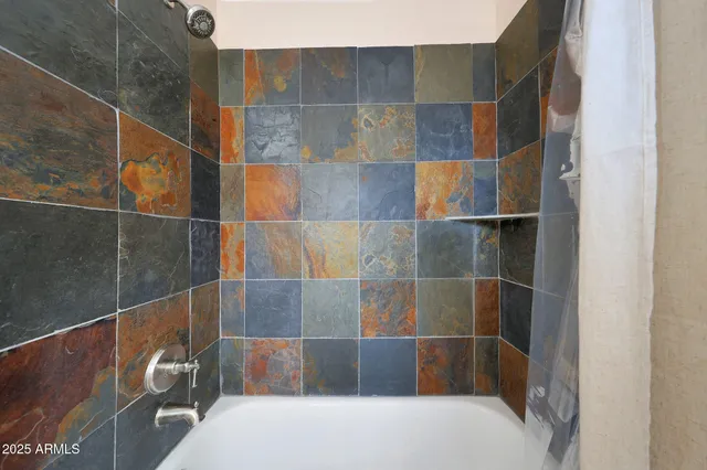 a view of a house with a backyard porch and sitting area