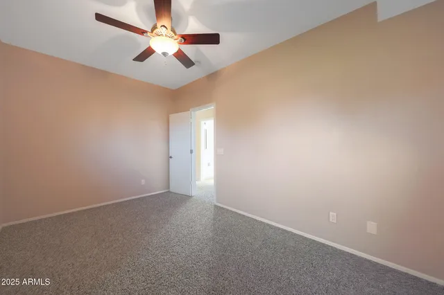 a view of a backyard with plants and lake view