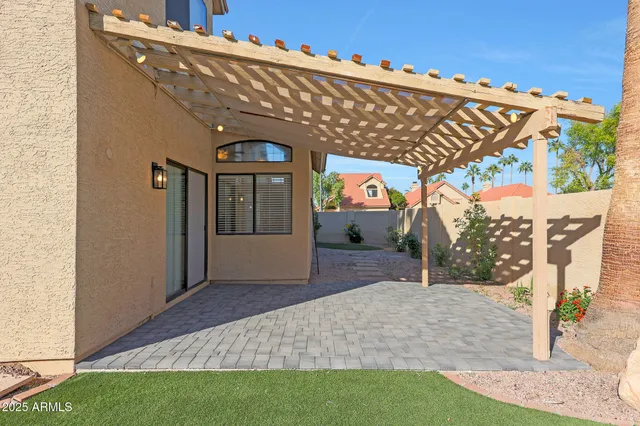 an aerial view of residential houses with outdoor space and street view