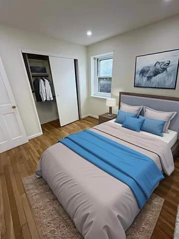 a bedroom with a large bed and a window