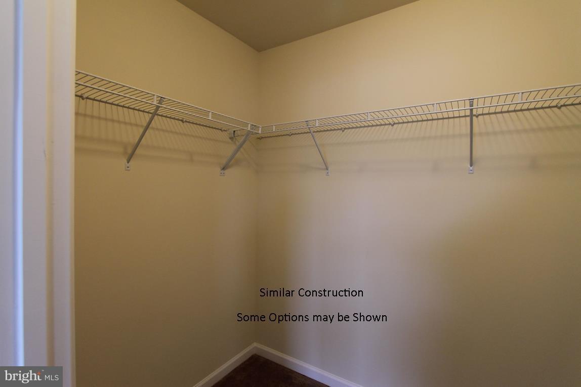 0 Rumbling Rock Road Hedgesville, WV 25427 - Photo 12 of 19 a view of a room with racks on the wall
