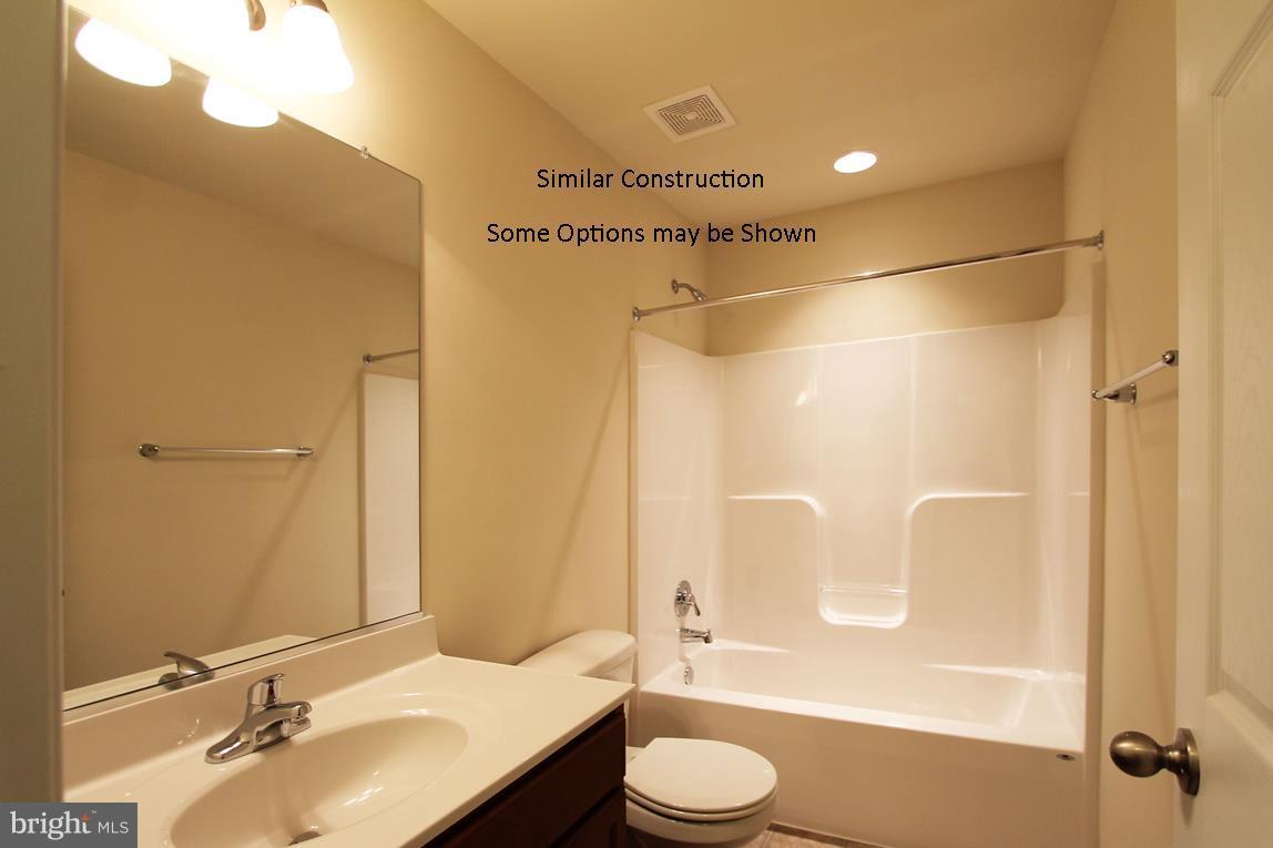 0 Rumbling Rock Road Hedgesville, WV 25427 - Photo 18 of 19 a bathroom with a sink a toilet and shower