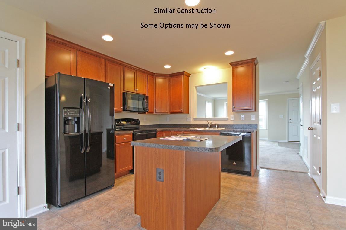 0 Rumbling Rock Road Hedgesville, WV 25427 - Photo 6 of 19 a kitchen with stainless steel appliances granite countertop a refrigerator a sink and a oven