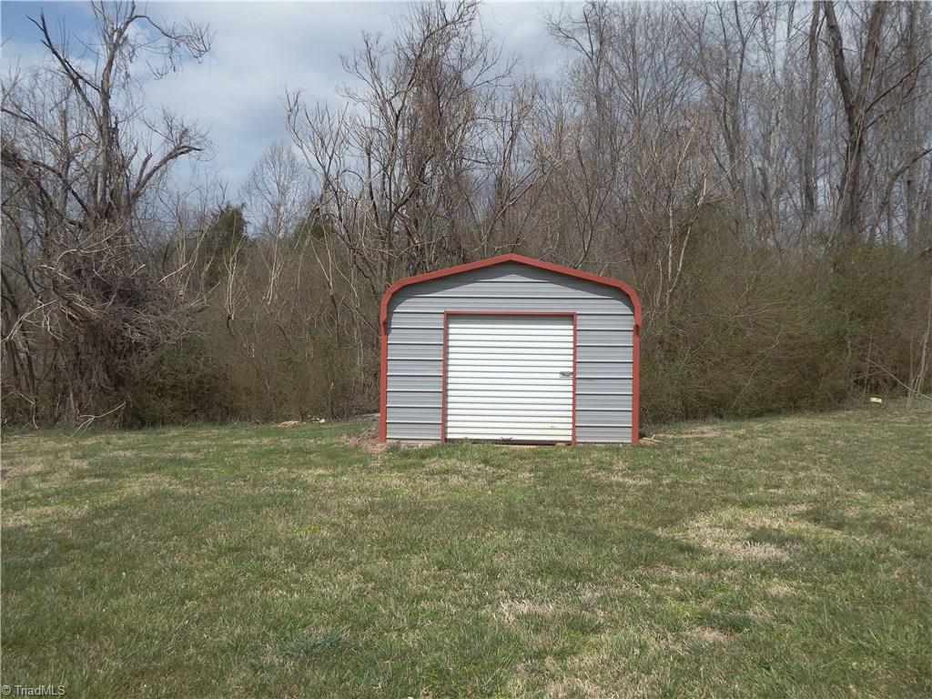 3235 Wide Country Road Pfafftown, NC 27040 - Photo 15 of 17 Metal Storage Building with Concrete Floor and Roll Up Door REMAINS!