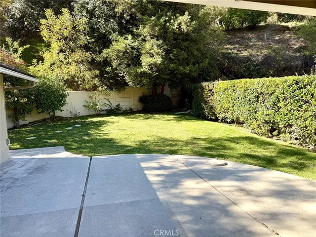 a view of a yard with an outdoor space