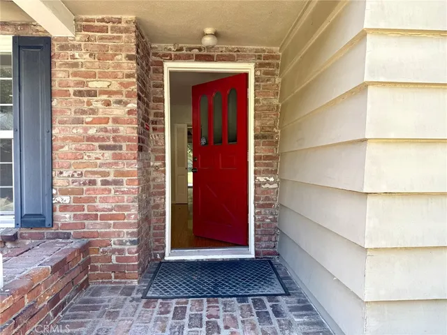 a view of a door of the house with a door