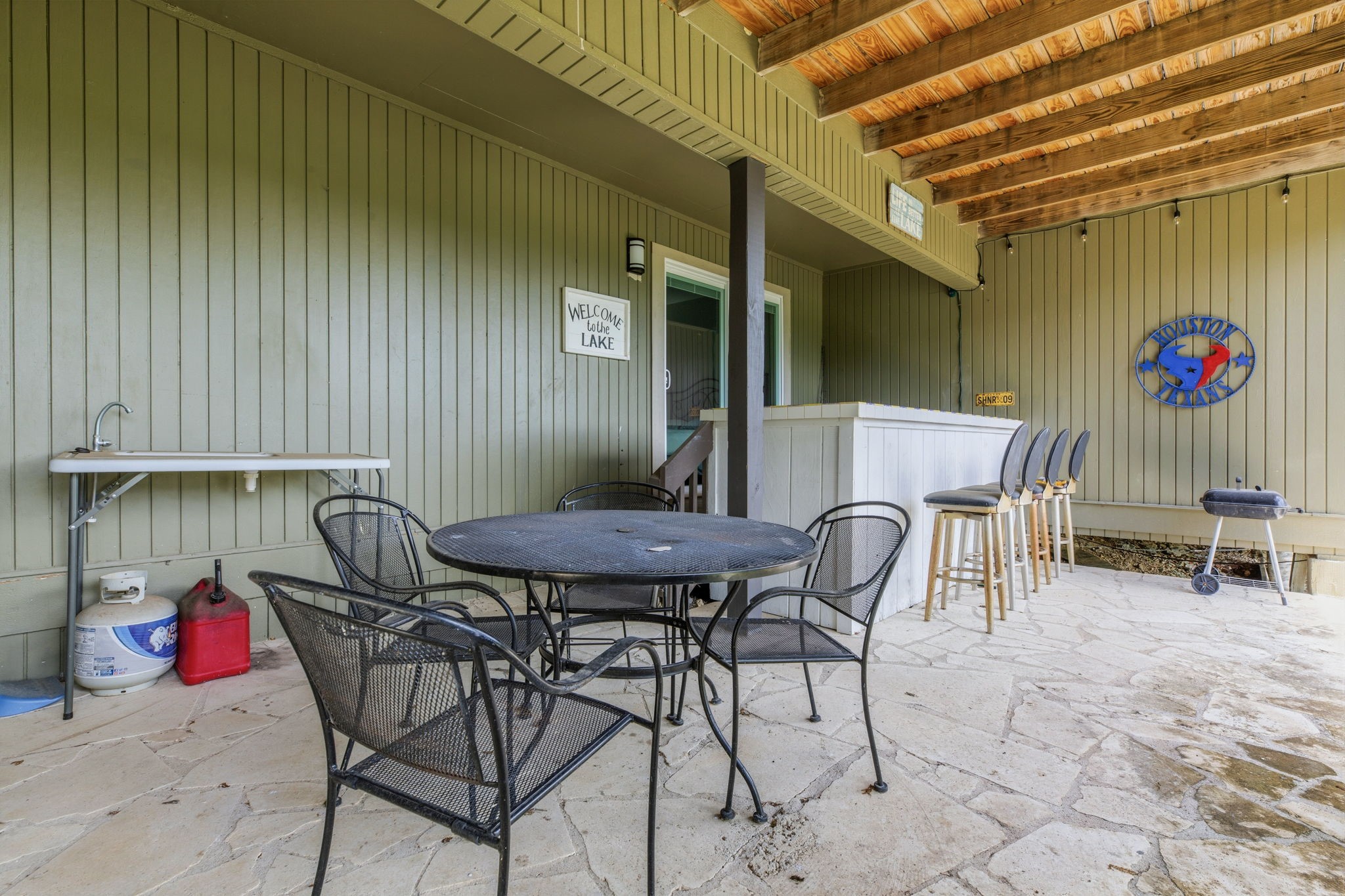 319 Venture Boulevard South Point Venture, TX 78645 - Photo 25 of 25 It's party time on the lower level back deck! Deer will often come right up to you as you enjoy the evening.