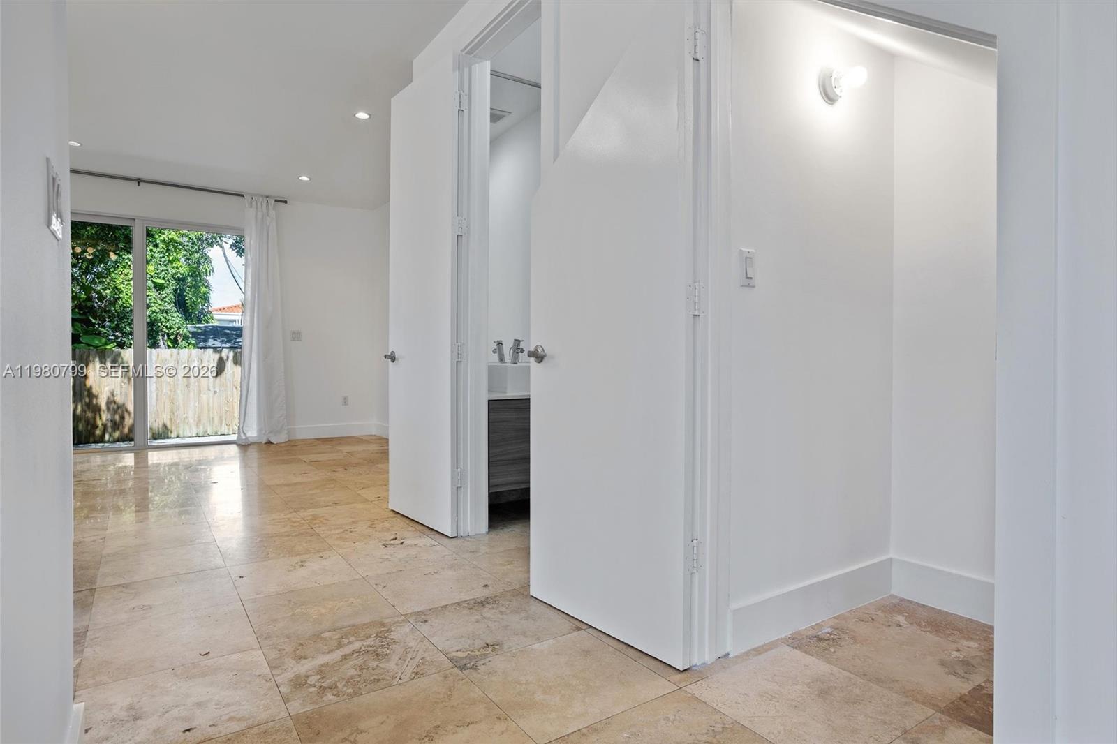 2786 Southwest 34th Avenue Miami, FL 33133 - Photo 14 of 42 a view of a hallway with wooden shelves