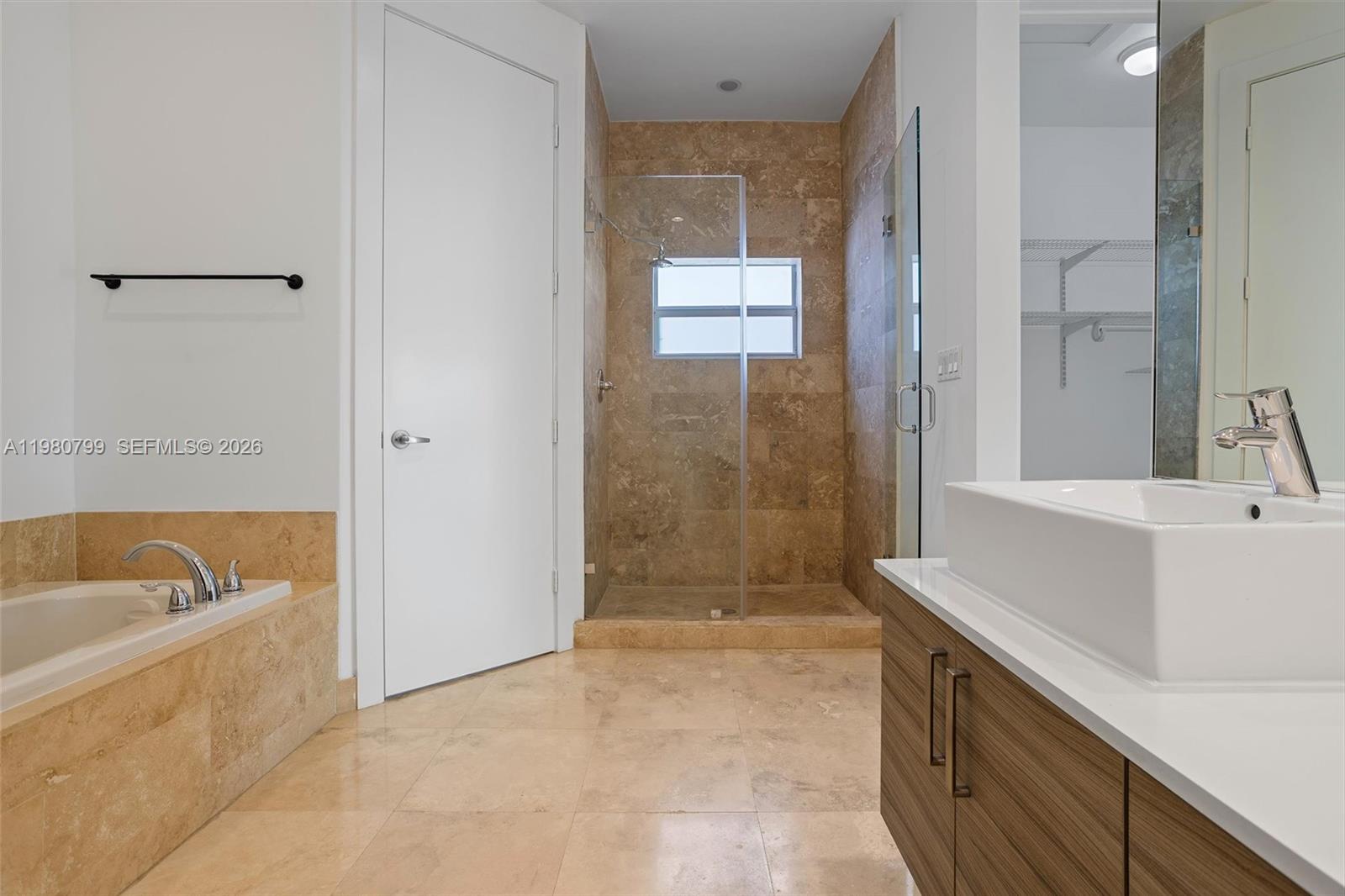 2786 Southwest 34th Avenue Miami, FL 33133 - Photo 21 of 42 a bathroom with a tub a sink and a shower
