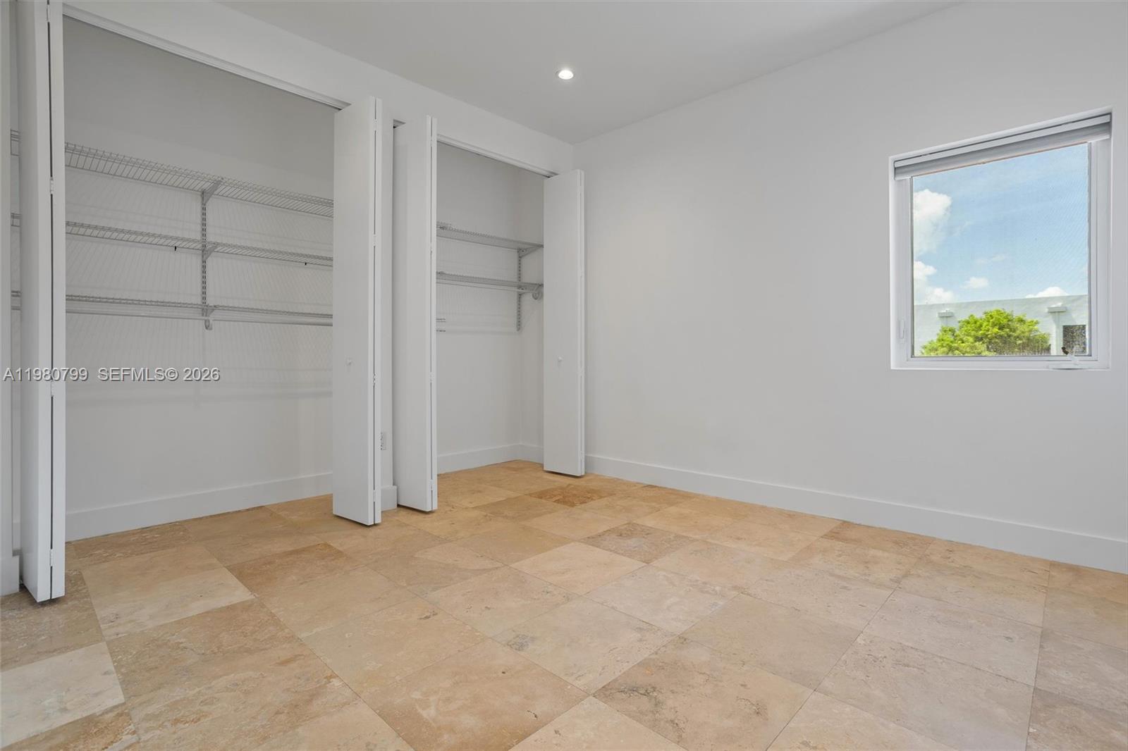 2786 Southwest 34th Avenue Miami, FL 33133 - Photo 23 of 42 an empty room with closet and windows