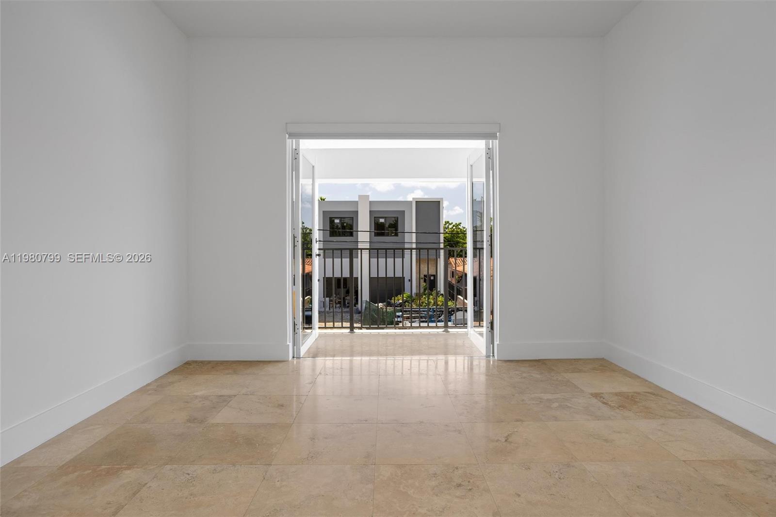 2786 Southwest 34th Avenue Miami, FL 33133 - Photo 26 of 42 a view of an empty room with glass door
