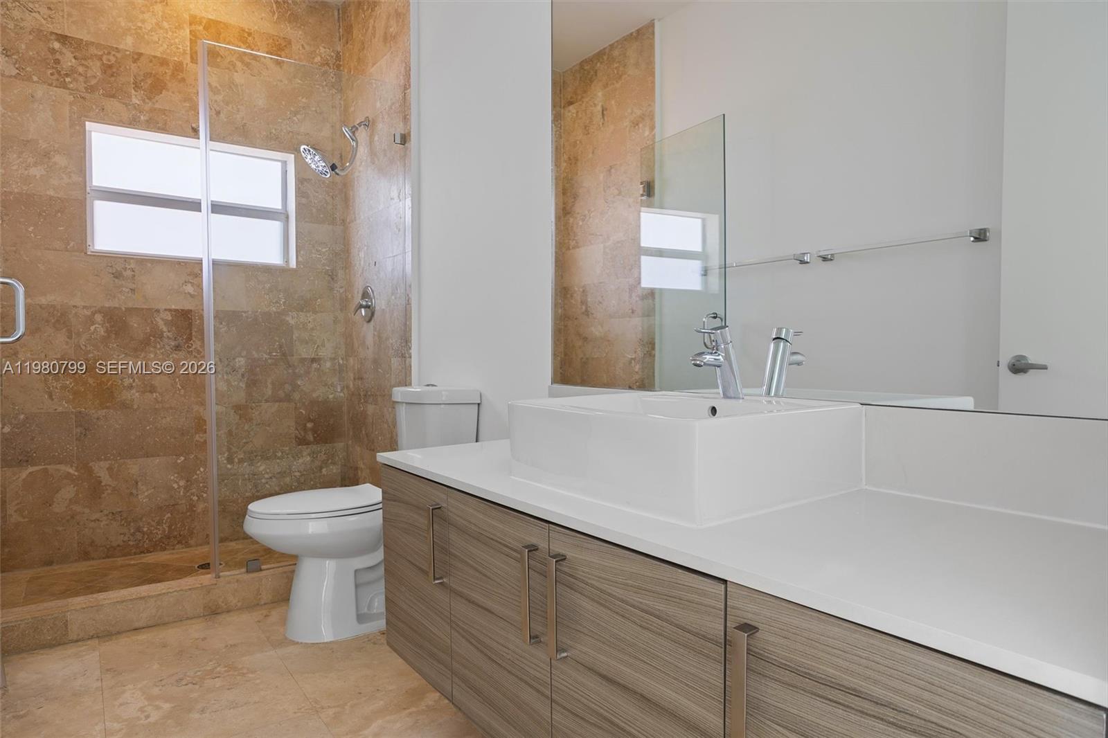 2786 Southwest 34th Avenue Miami, FL 33133 - Photo 27 of 42 a bathroom with a sink a toilet and shower