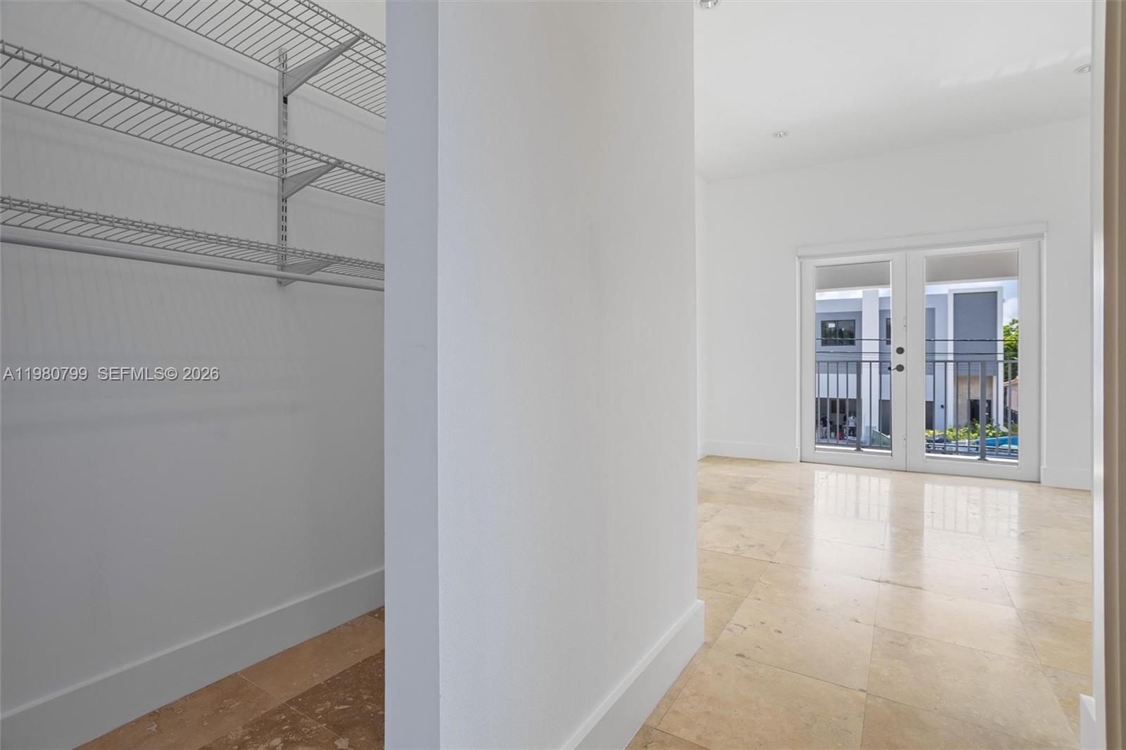 2786 Southwest 34th Avenue Miami, FL 33133 - Photo 30 of 42 a view of an empty room with wooden floor and a window