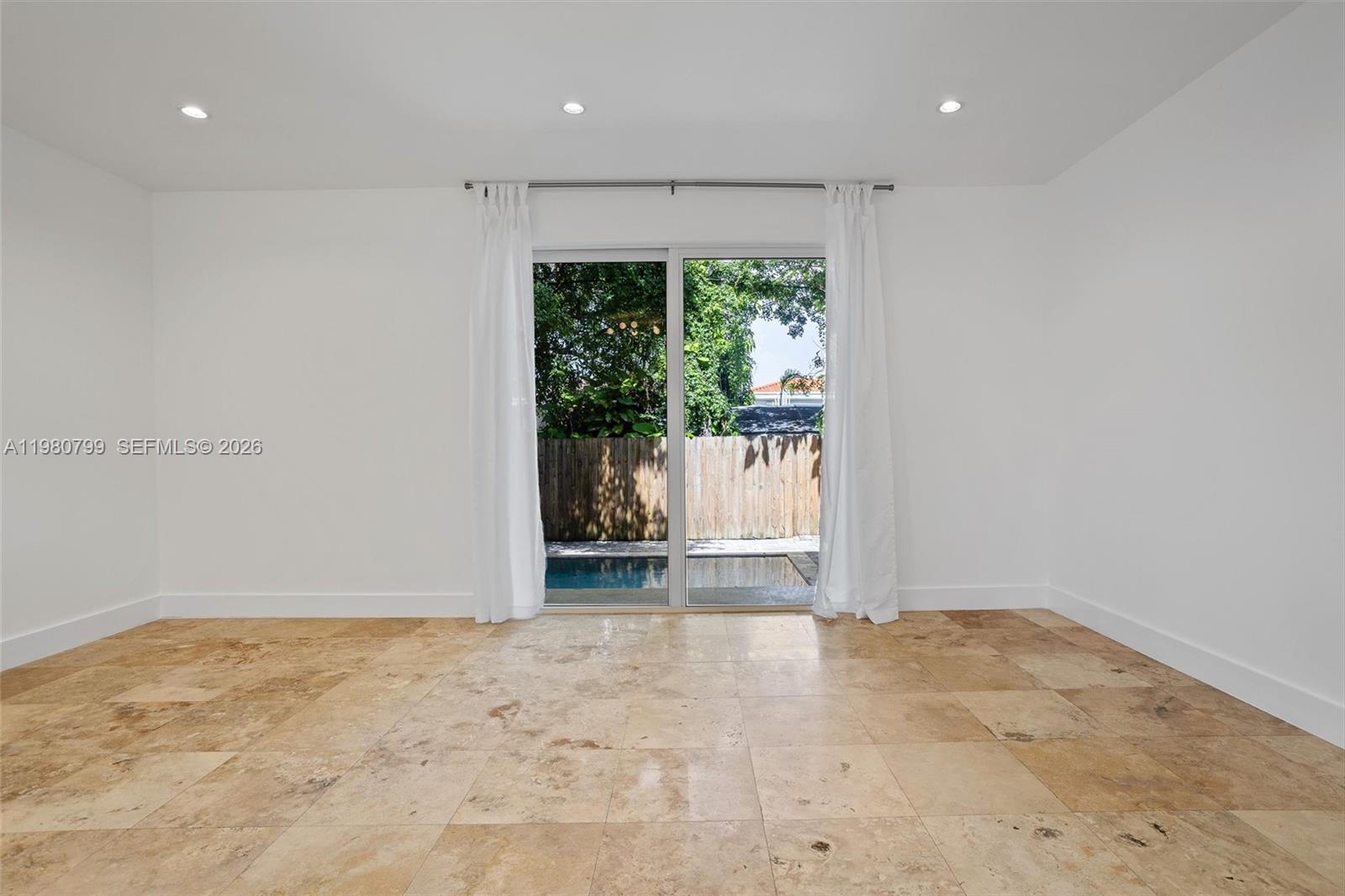 2786 Southwest 34th Avenue Miami, FL 33133 - Photo 9 of 42 a view of an empty room with a sliding door