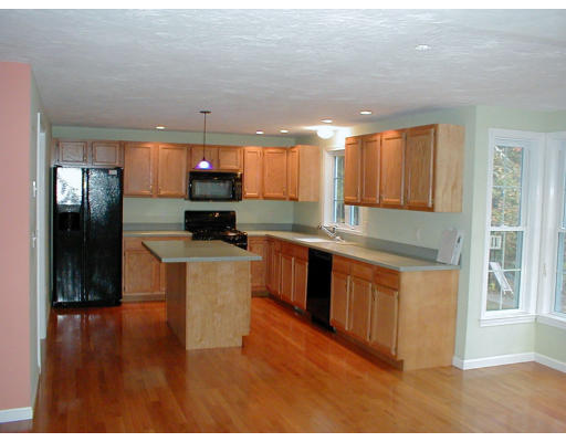 8 Labbe Road Groton, MA 01450 - Photo 3 of 8 a kitchen with stainless steel appliances granite countertop a stove a sink and a refrigerator