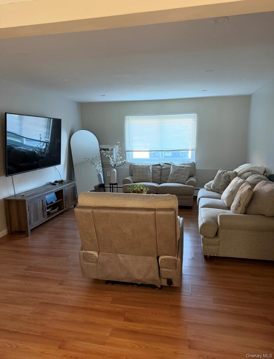 19 Tanager Road, Unit 1902 Monroe, NY 10950 - Photo 5 of 9 a living room with furniture and a flat screen tv