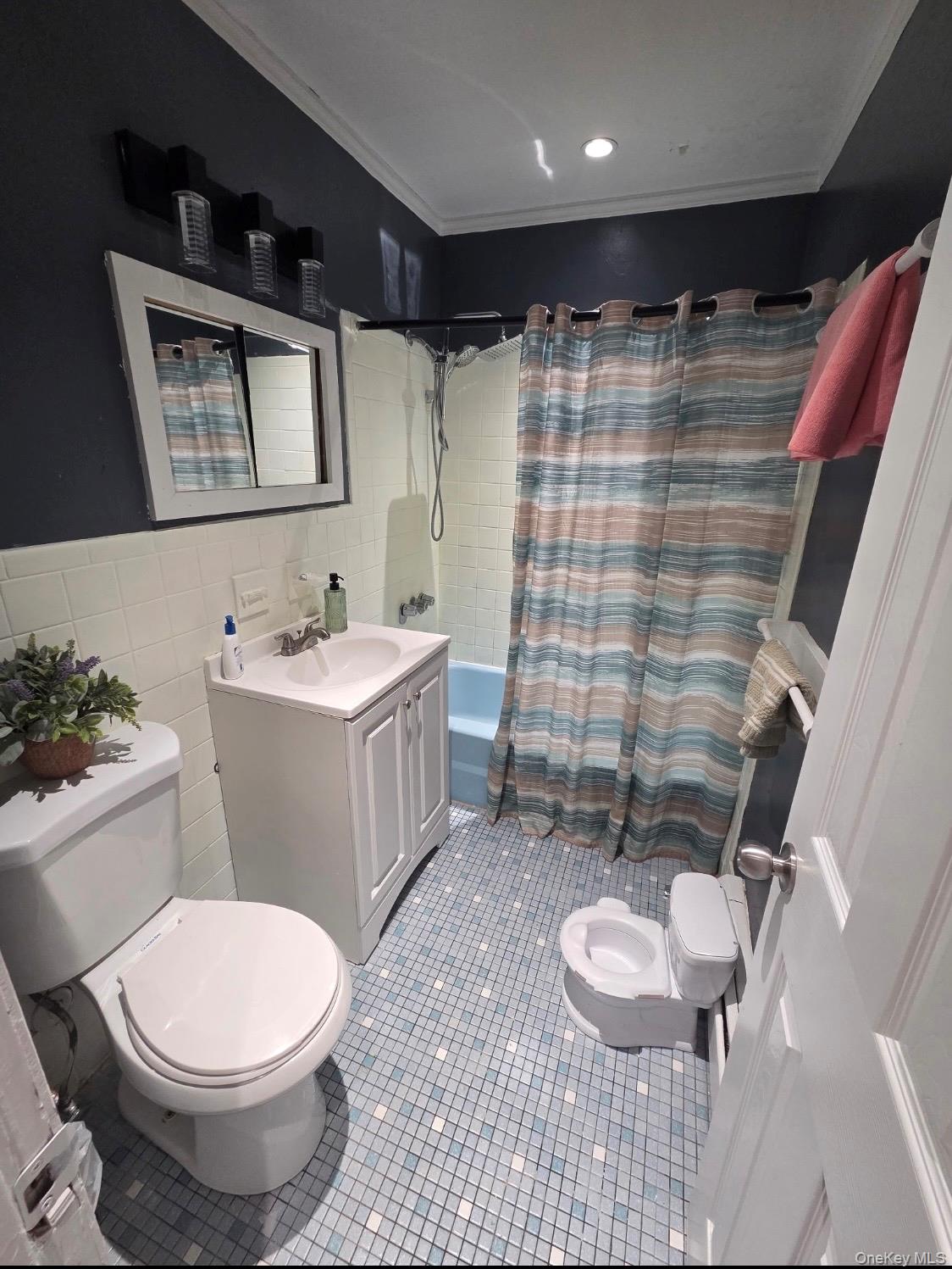 19 Tanager Road, Unit 1902 Monroe, NY 10950 - Photo 6 of 9 a bathroom with a sink toilet and shower