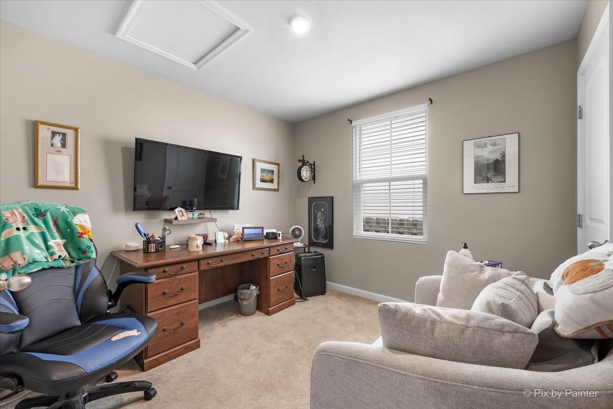 205 North Buckeye Street Waterman, IL 60556 - Photo 16 of 34 a living room with furniture and a flat screen tv