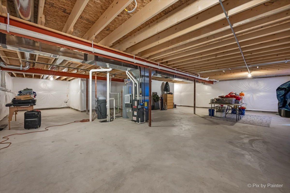 205 North Buckeye Street Waterman, IL 60556 - Photo 22 of 34 a view of a big room with air conditioner duct and materials on floor