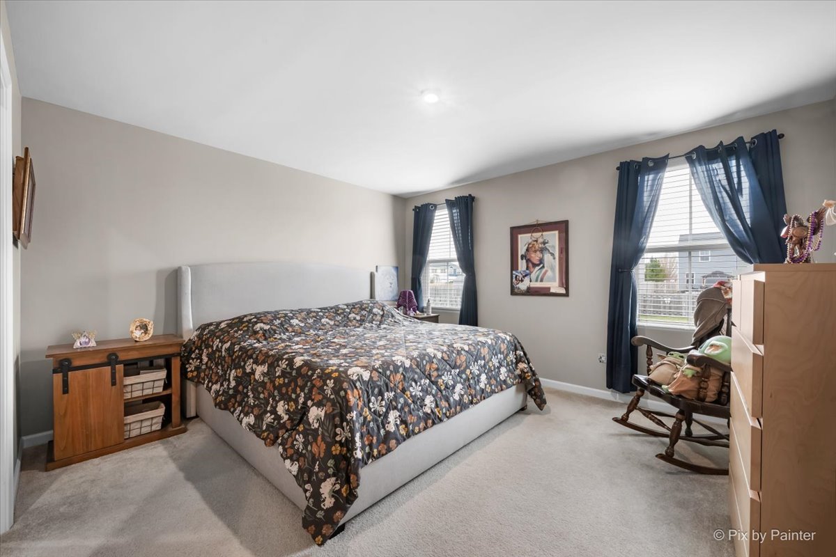 205 North Buckeye Street Waterman, IL 60556 - Photo 9 of 34 a bedroom with a bed and a window
