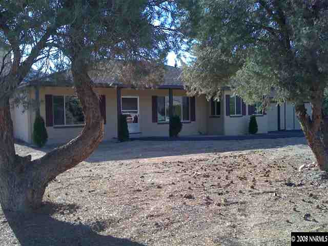 15110 Kivett Lane Reno, NV 89521 - Photo 1 of 9 a front view of a house with a yard