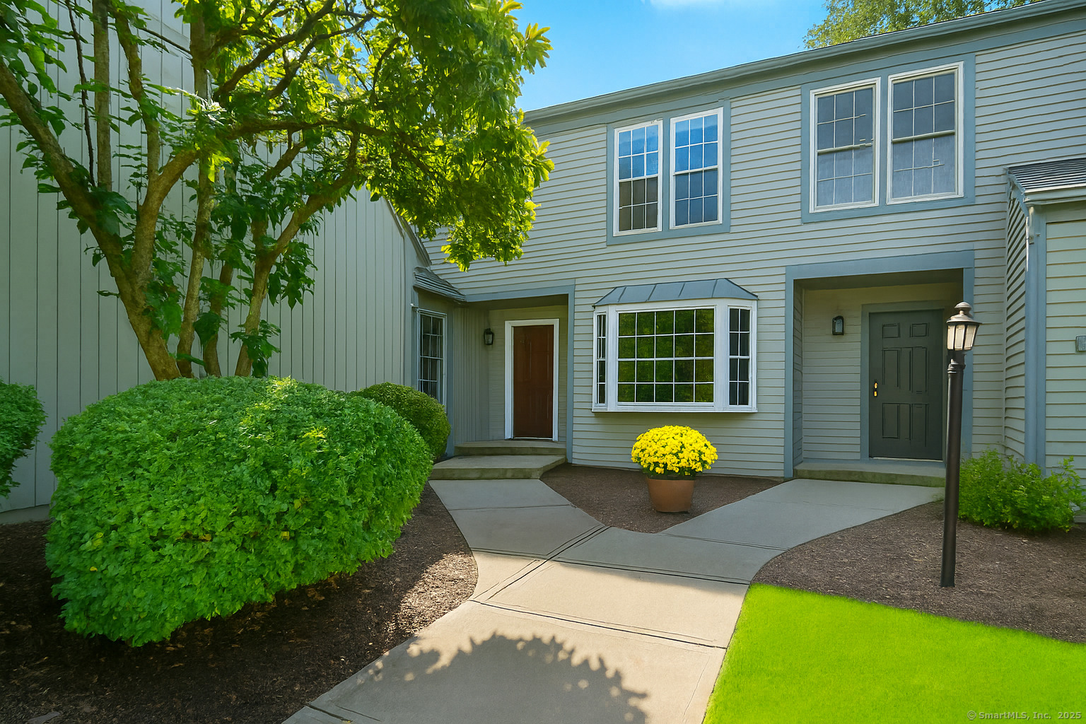 a front view of a house with garden