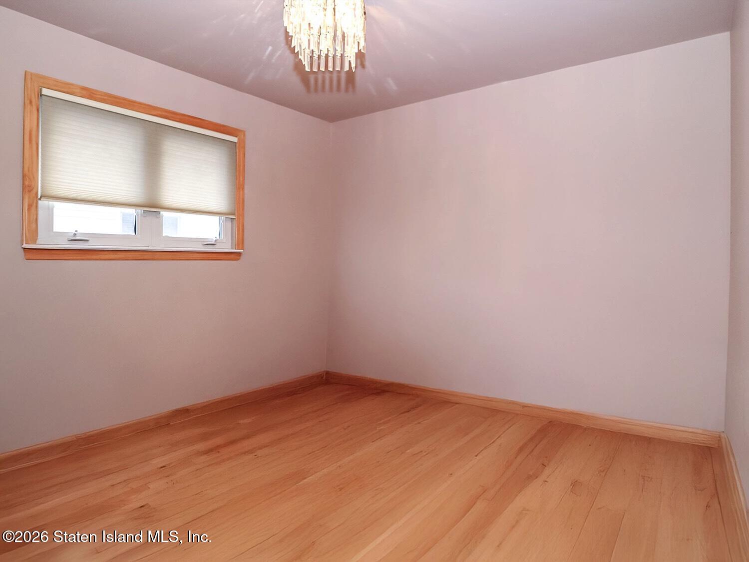 11 Firth Road Staten Island, NY 10314 - Photo 12 of 34 a view of an empty room with a window