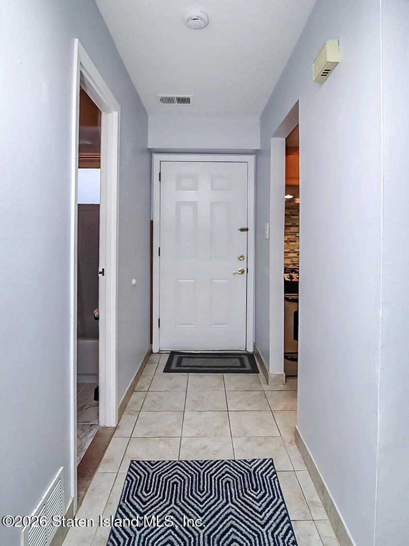 11 Firth Road Staten Island, NY 10314 - Photo 17 of 34 a view of a room & wooden floor