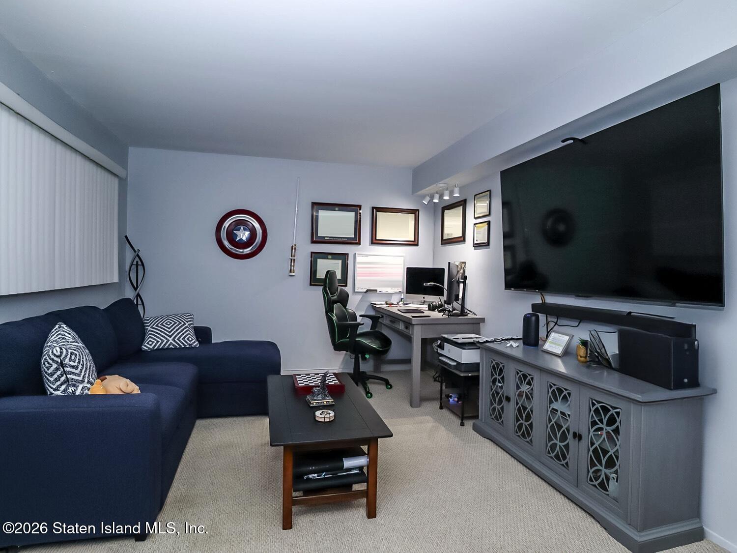 11 Firth Road Staten Island, NY 10314 - Photo 18 of 34 a living room with furniture and a flat screen tv