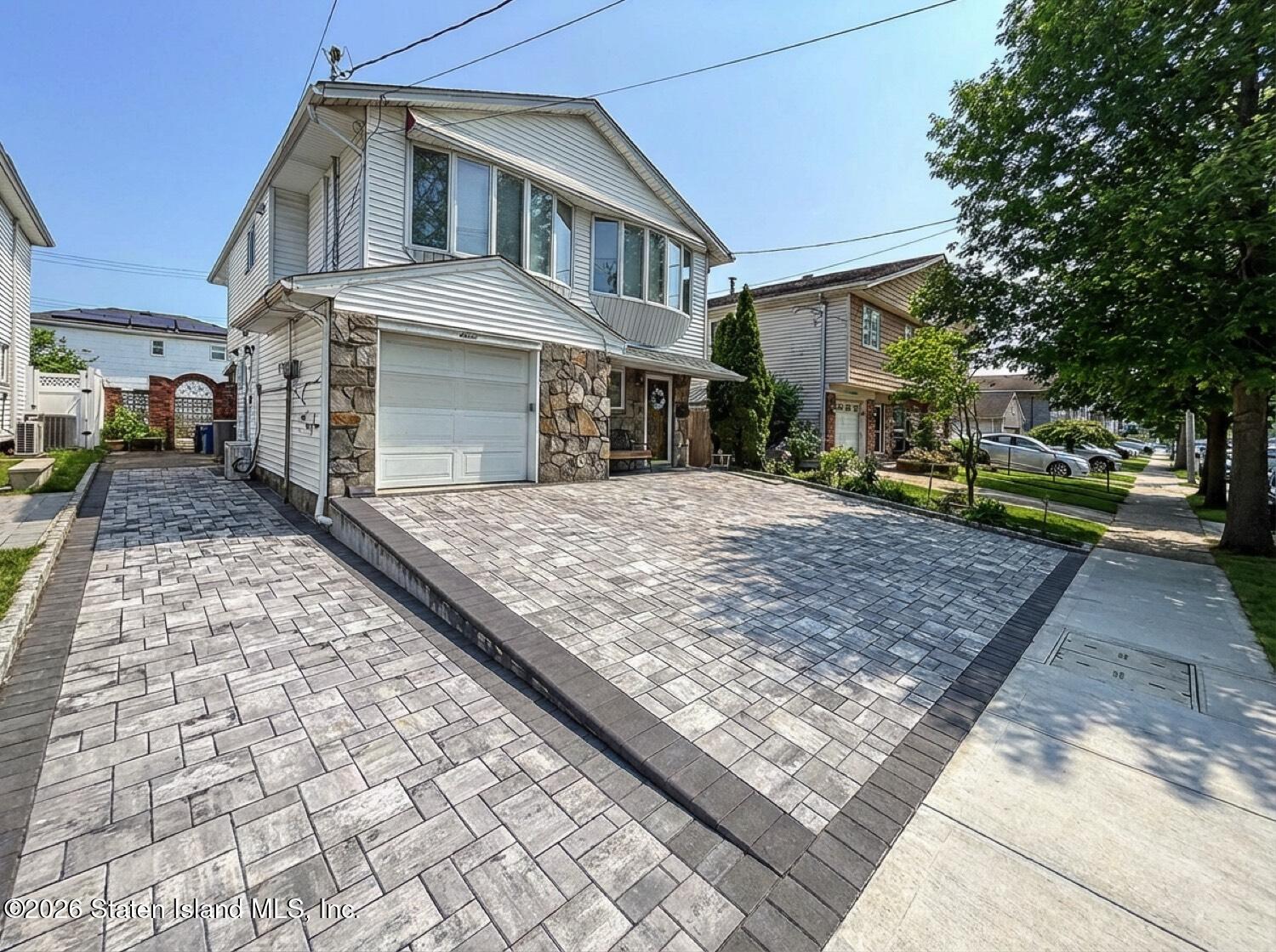 11 Firth Road Staten Island, NY 10314 - Photo 2 of 34 a front view of a house with a yard