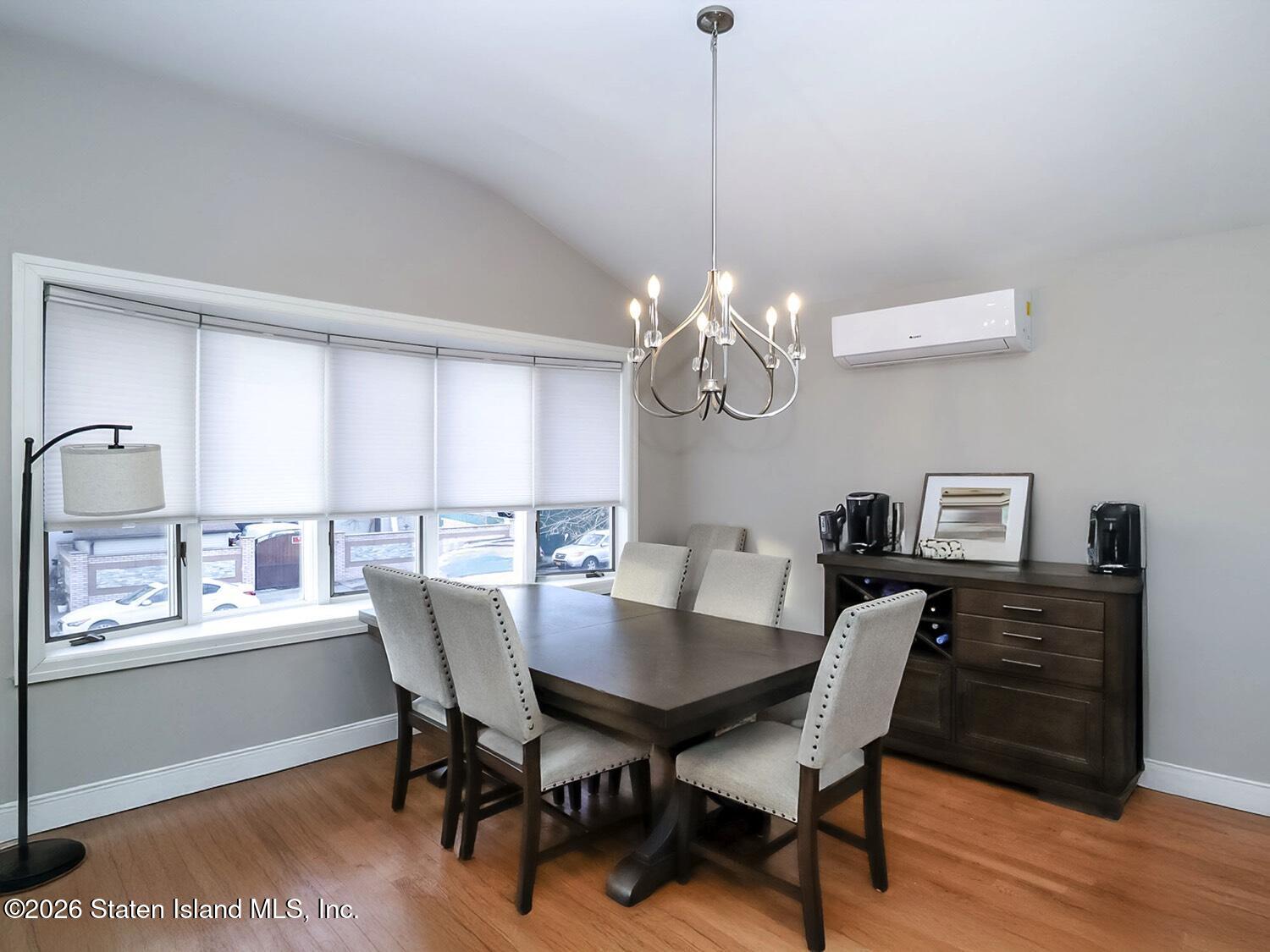 11 Firth Road Staten Island, NY 10314 - Photo 5 of 34 a view of a dining room with furniture a chandelier and wooden floor