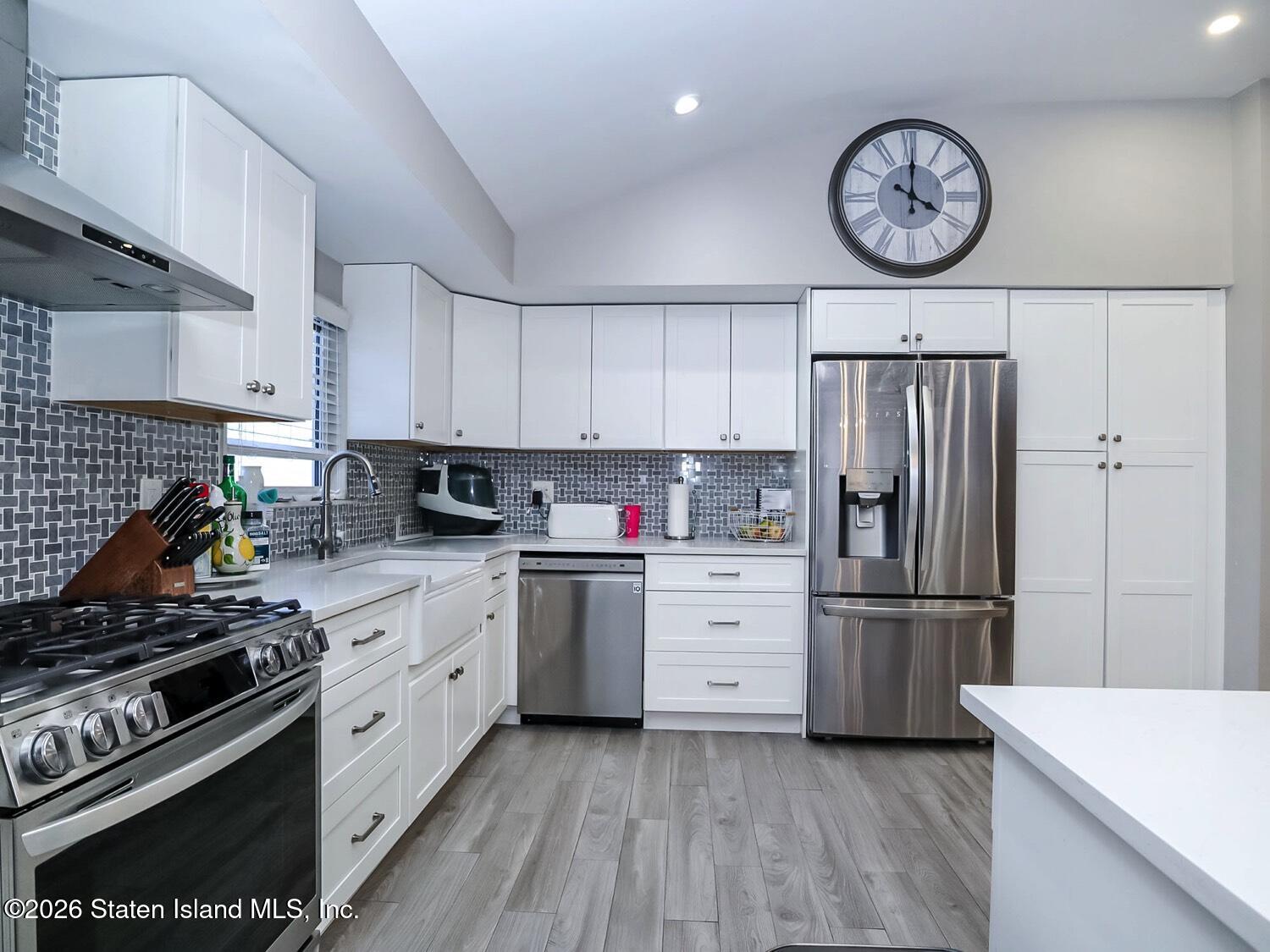 11 Firth Road Staten Island, NY 10314 - Photo 7 of 34 a kitchen with cabinets stainless steel appliances and a window