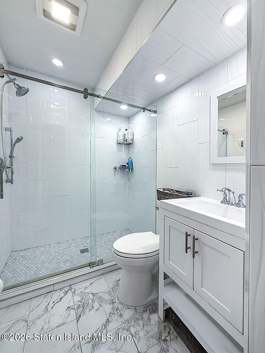 11 Firth Road Staten Island, NY 10314 - Photo 10 of 34 a bathroom with a sink toilet and shower