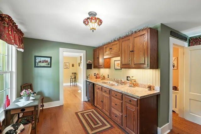 a bathroom with a sink a vanity and a mirror