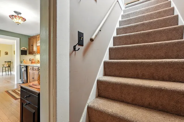 a view of livingroom with furniture and staircase