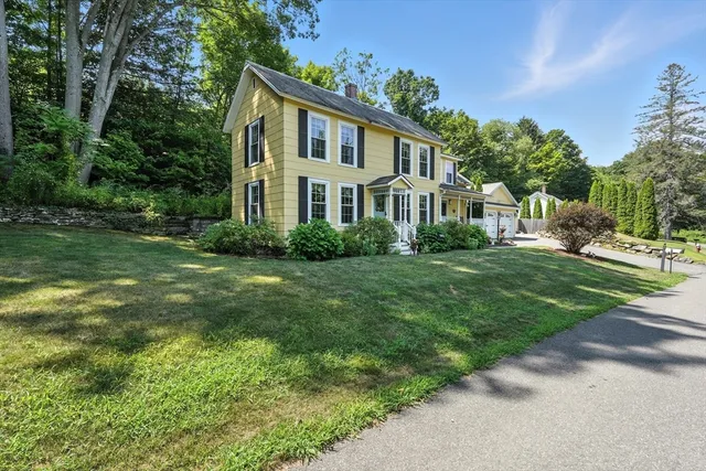 a front view of a house with a yard