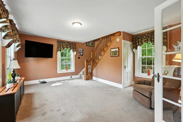 a view of livingroom with furniture wooden floor and windows
