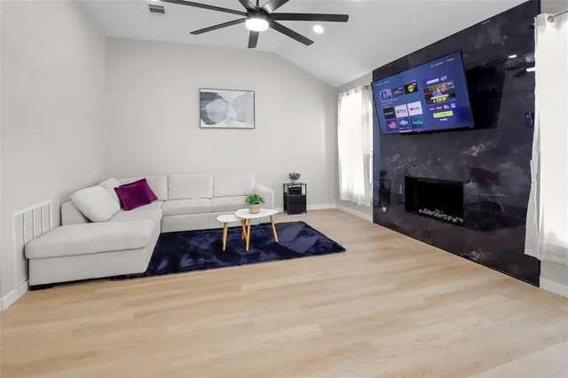 a living room with furniture and a fireplace