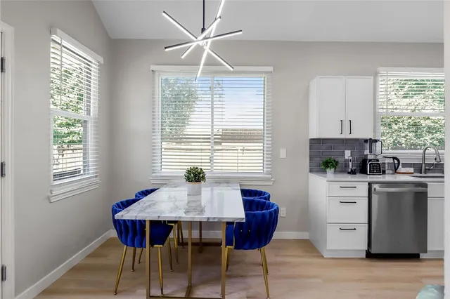 a view of a dining room with furniture window and wooden floor