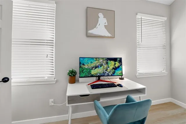 a dining room with furniture and a window