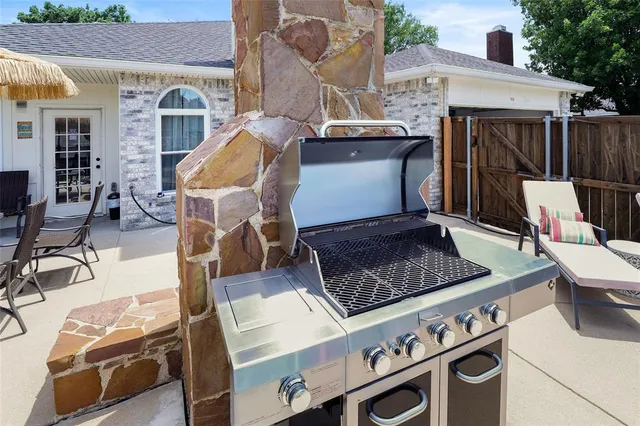 a front view of a house with outdoor seating